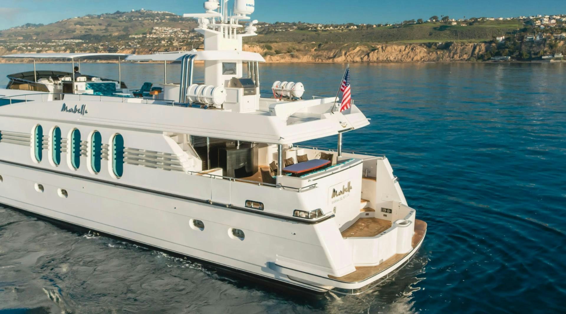a large white ship in the water aboard MARBELLA Yacht for Sale