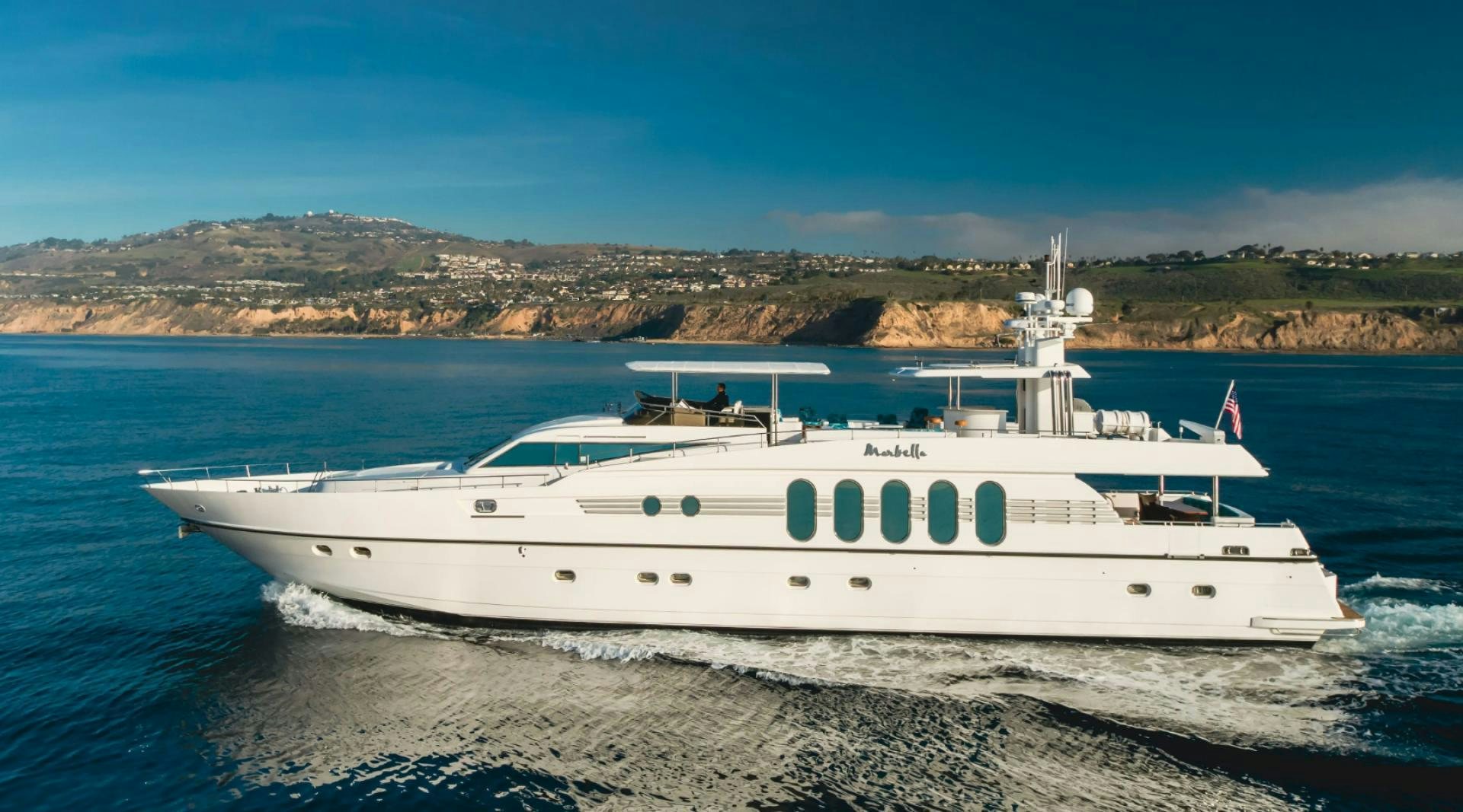 a white yacht on the beach aboard MARBELLA Yacht for Sale
