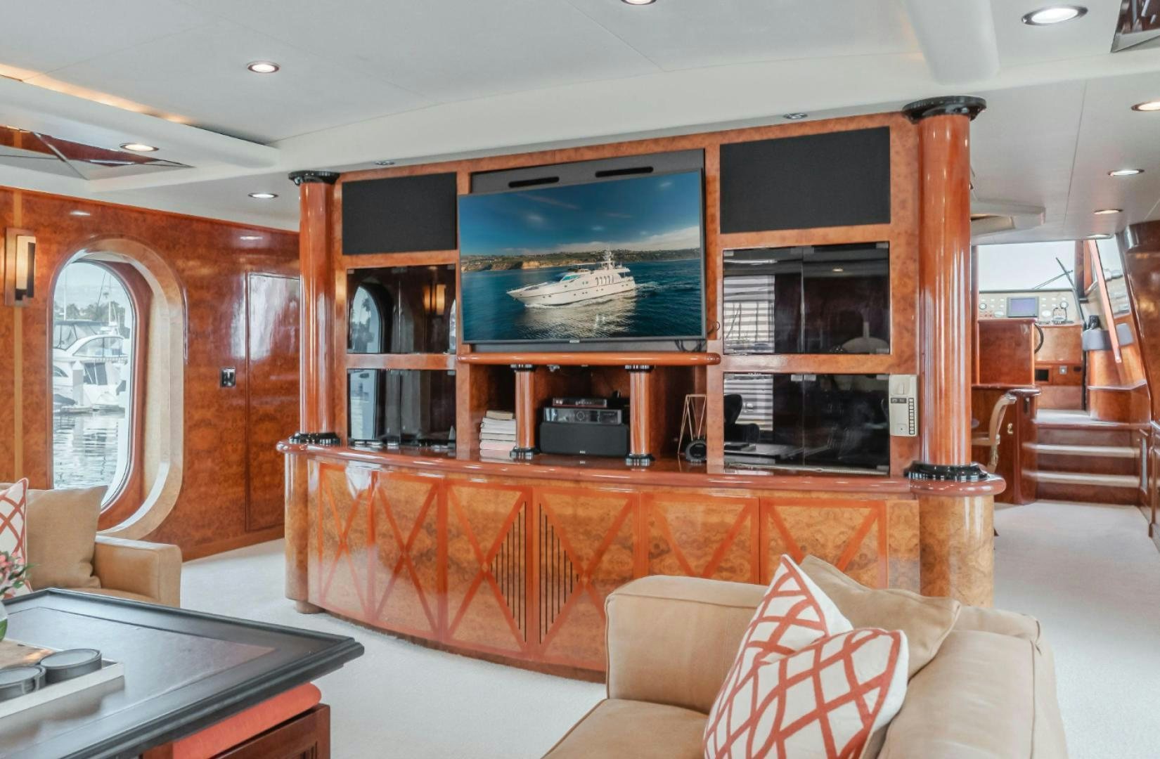 a living room with a fireplace aboard MARBELLA Yacht for Sale