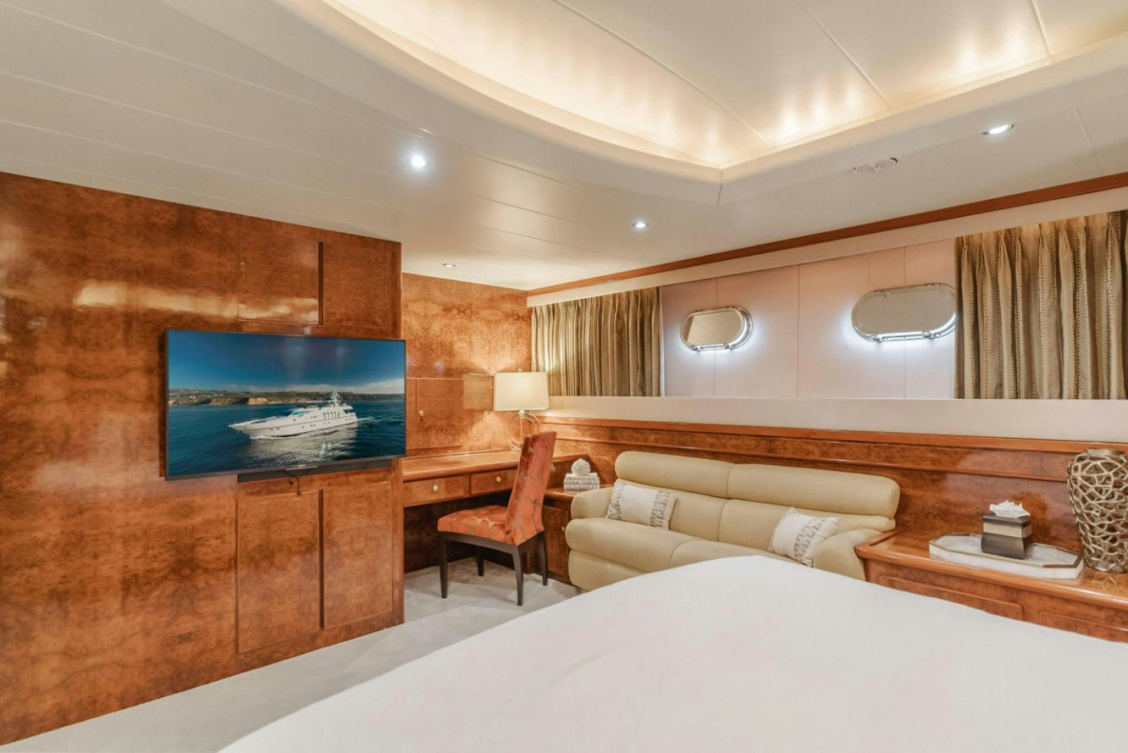 a room with a bed and a chair aboard MARBELLA Yacht for Sale