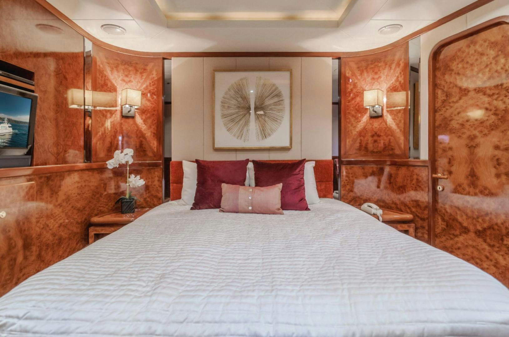 a bed with pillows and a mirror aboard MARBELLA Yacht for Sale