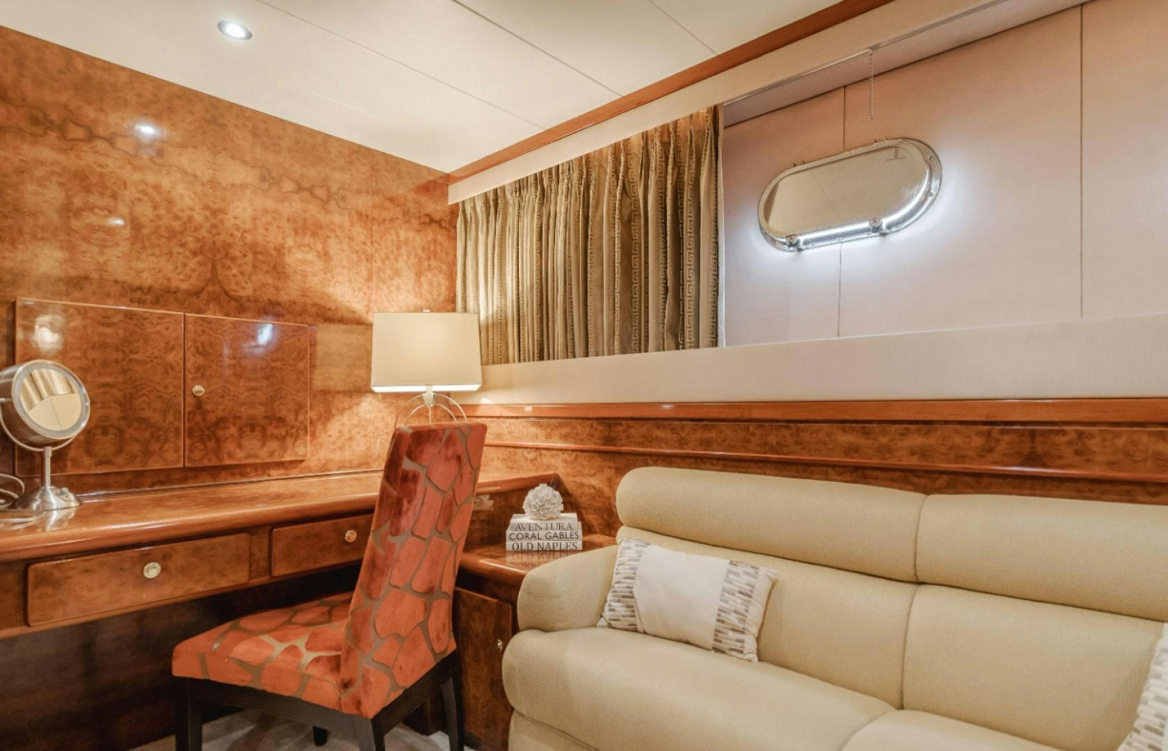 a room with a couch and a table aboard MARBELLA Yacht for Sale