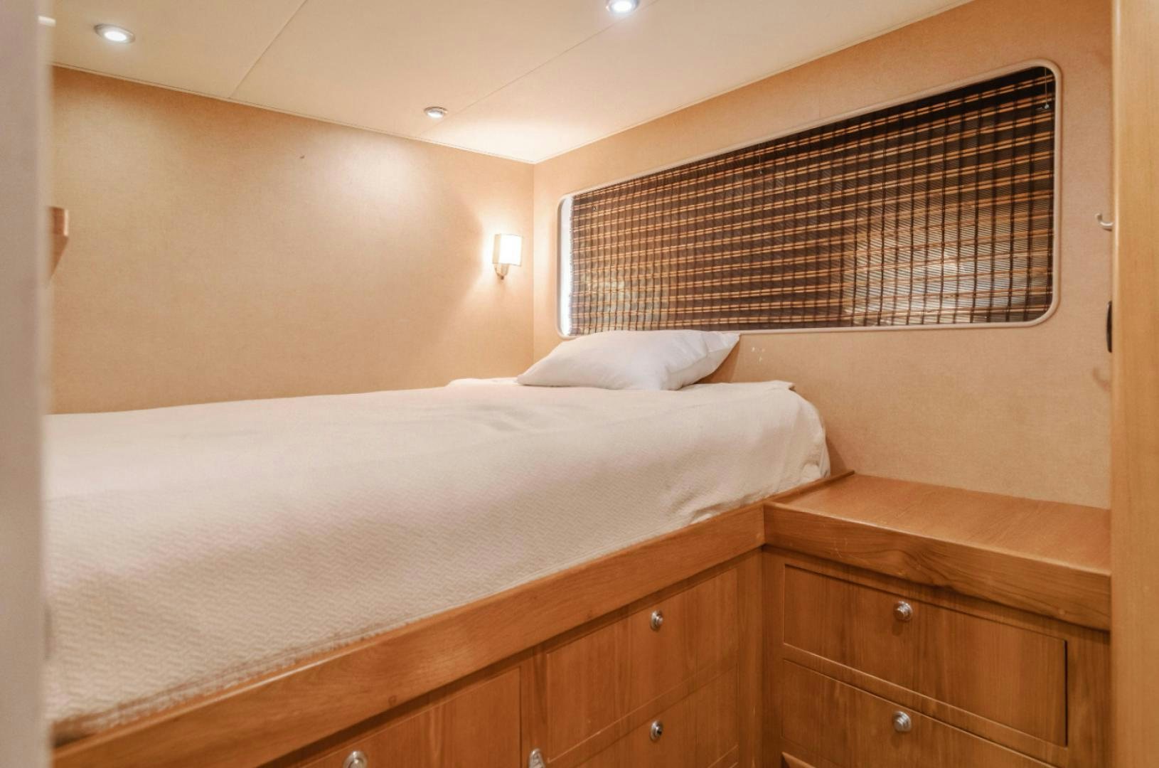 a bed with a white sheet aboard MARBELLA Yacht for Sale