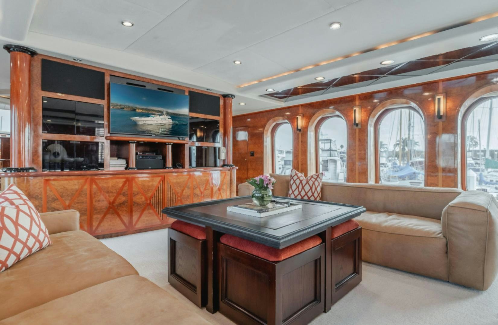 a living room with a table and couches aboard MARBELLA Yacht for Sale