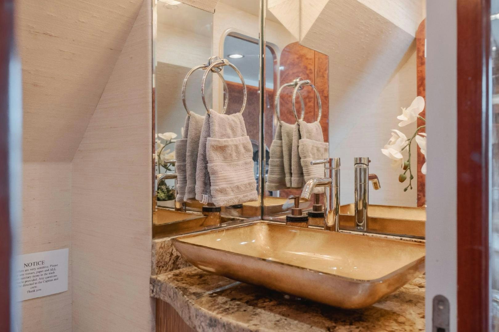 a bathroom with a sink and towels aboard MARBELLA Yacht for Sale