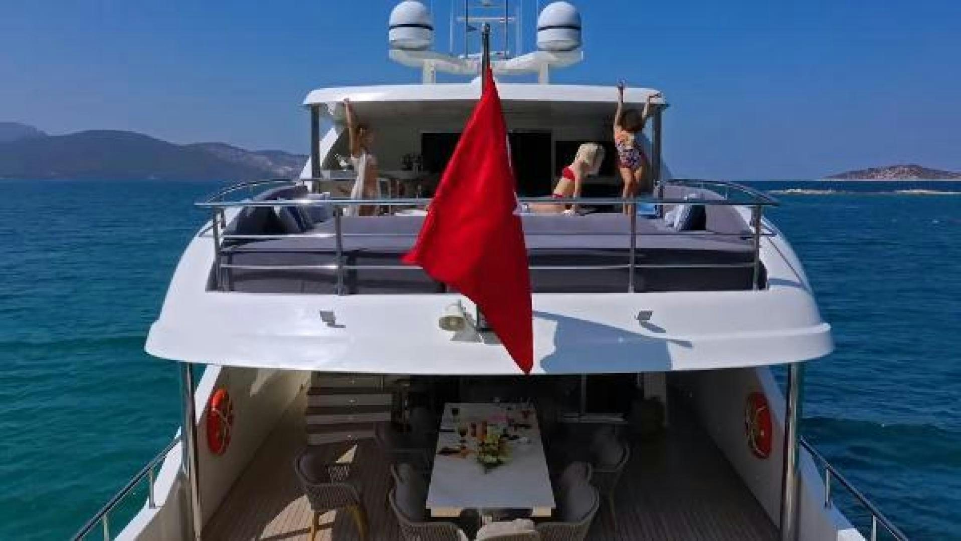 a boat with a red and white stripe on the front aboard VETRO Yacht for Sale
