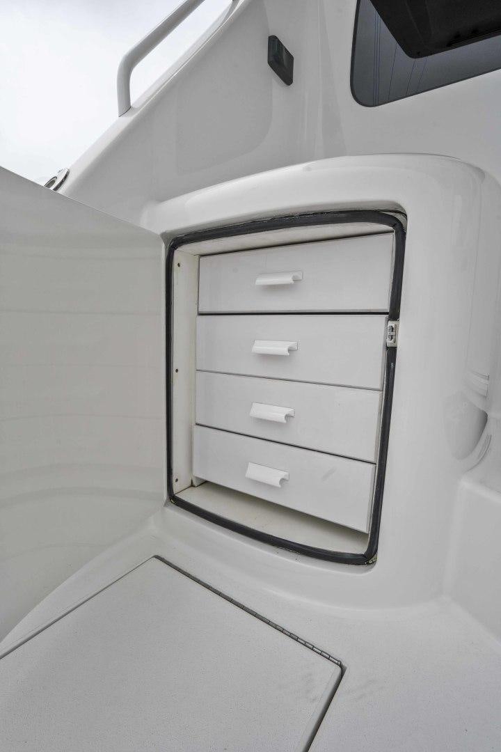 a white cabinet with drawers aboard LAST CALL Yacht for Sale