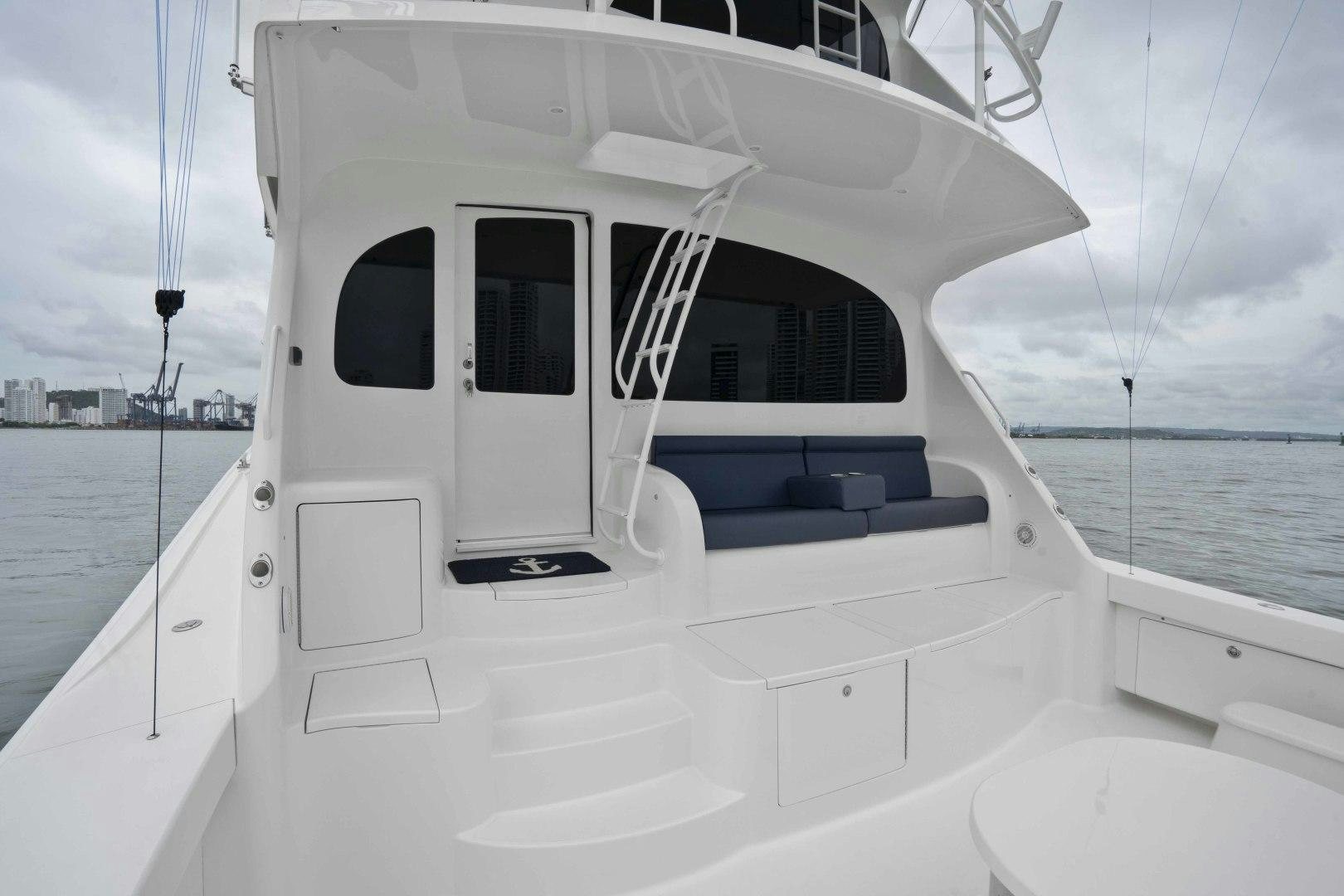 a white boat on the water aboard LAST CALL Yacht for Sale
