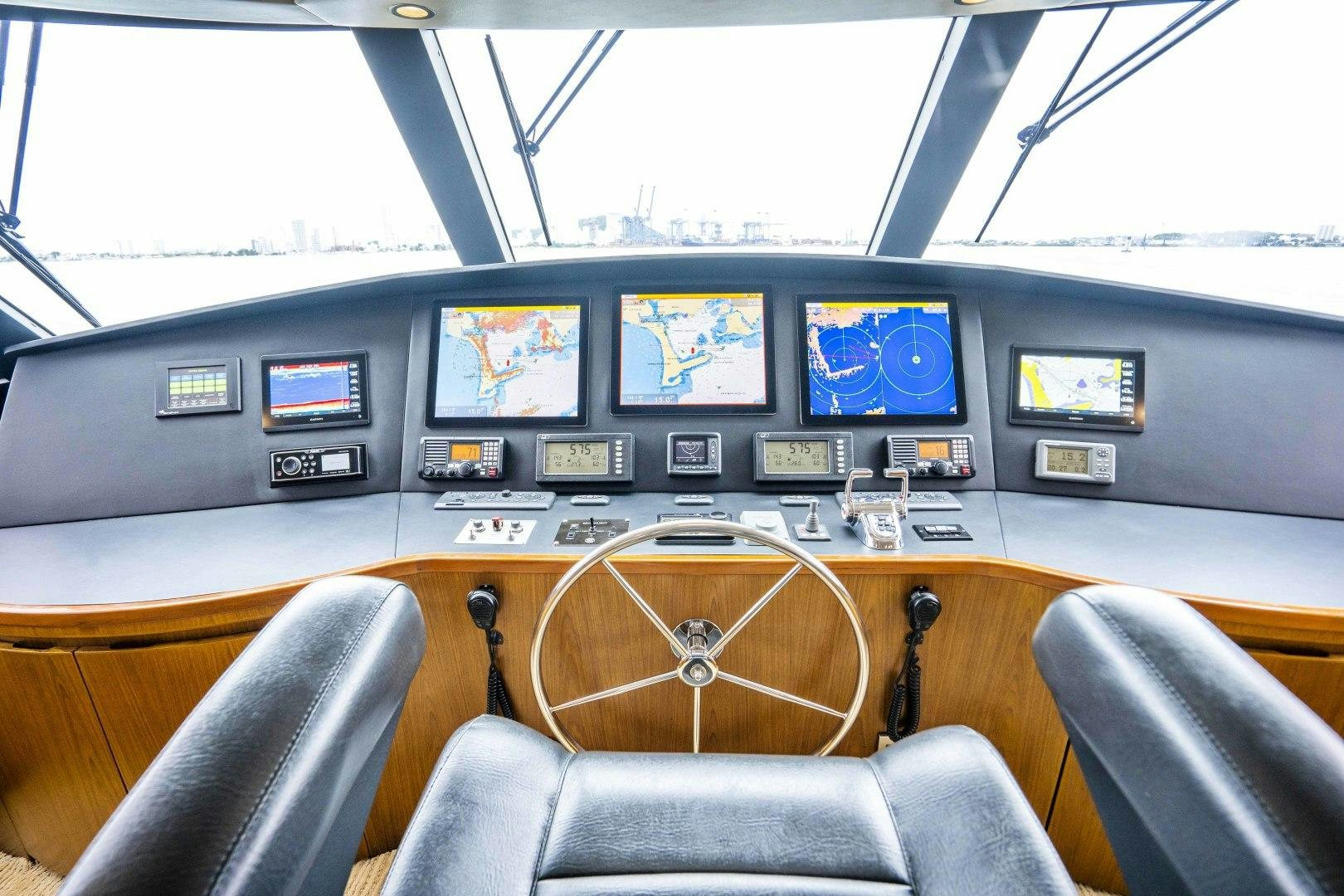 inside of a vehicle with screens aboard LAST CALL Yacht for Sale