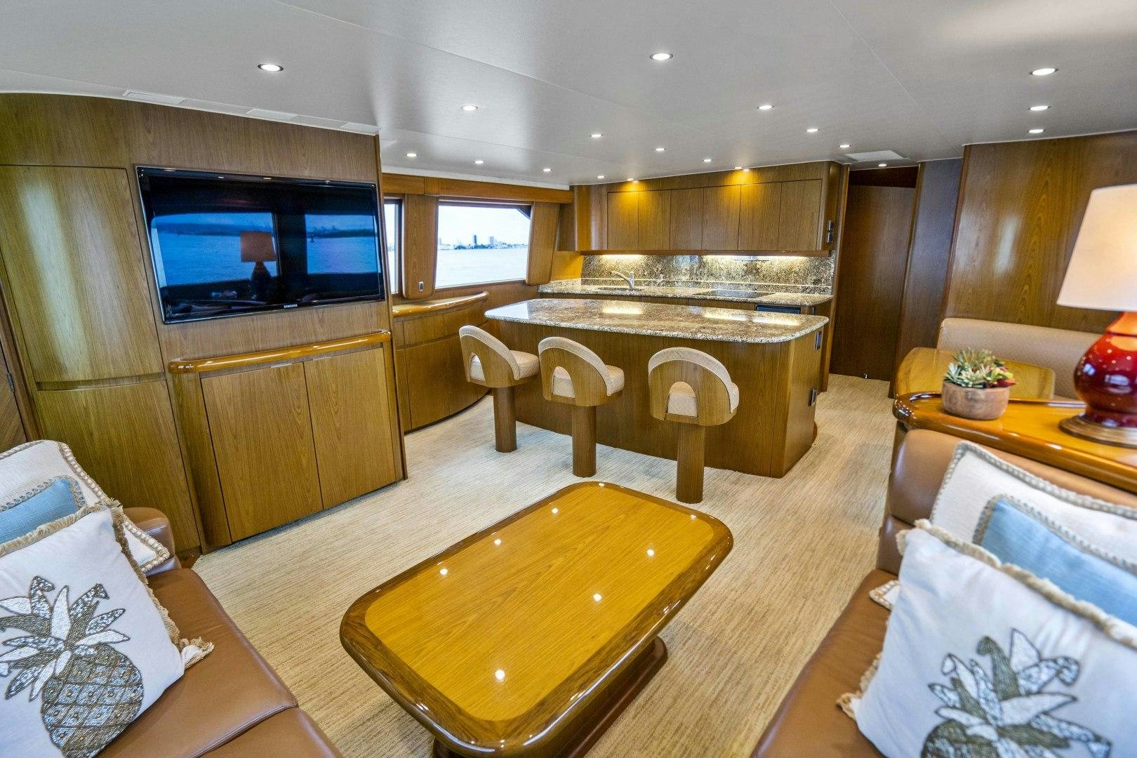 a large living room with a large table and chairs aboard LAST CALL Yacht for Sale
