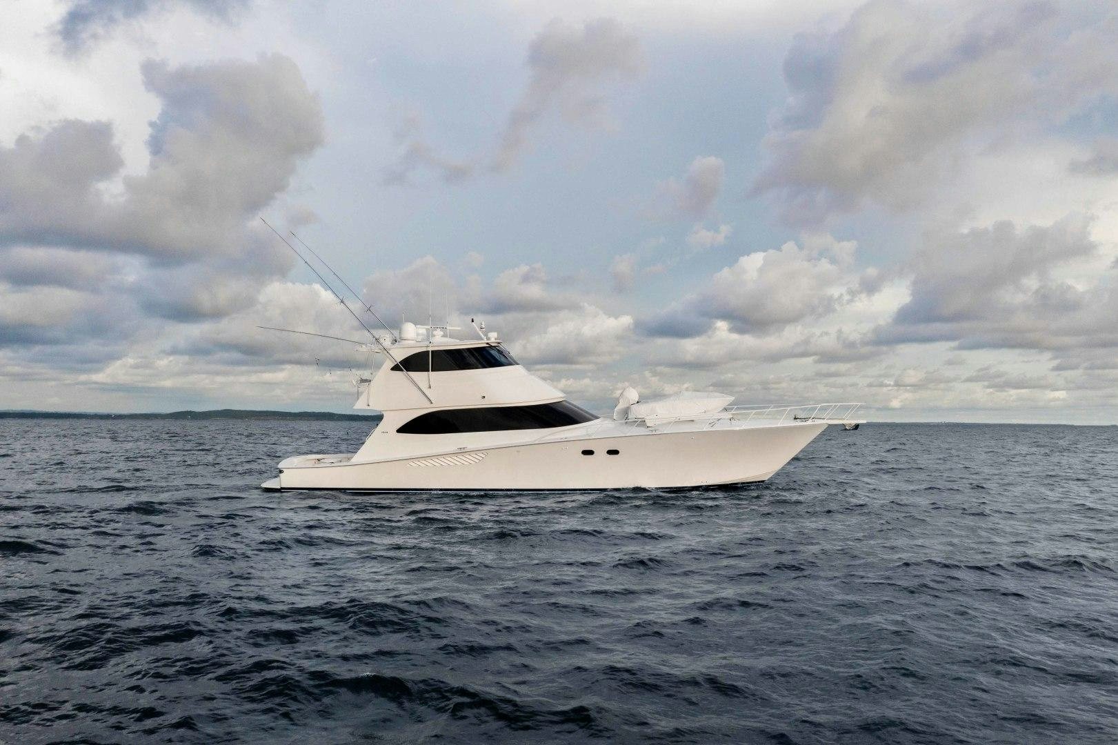 a white boat in the water aboard LAST CALL Yacht for Sale