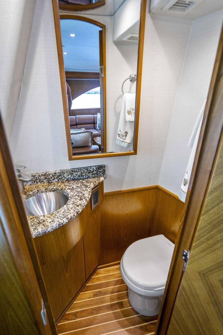 a bathroom with a sink and a toilet aboard LAST CALL Yacht for Sale