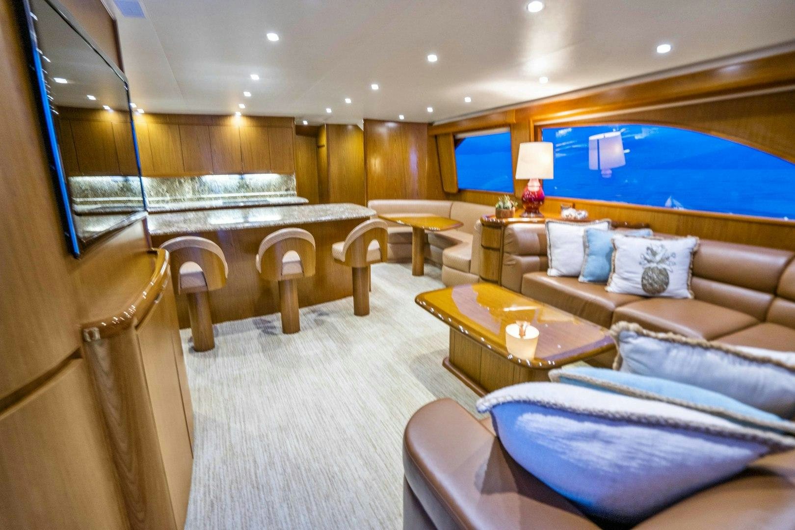 a large living room with a large window aboard LAST CALL Yacht for Sale