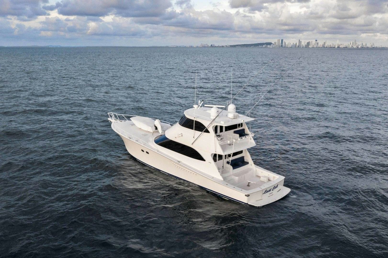 a white boat in the water aboard LAST CALL Yacht for Sale