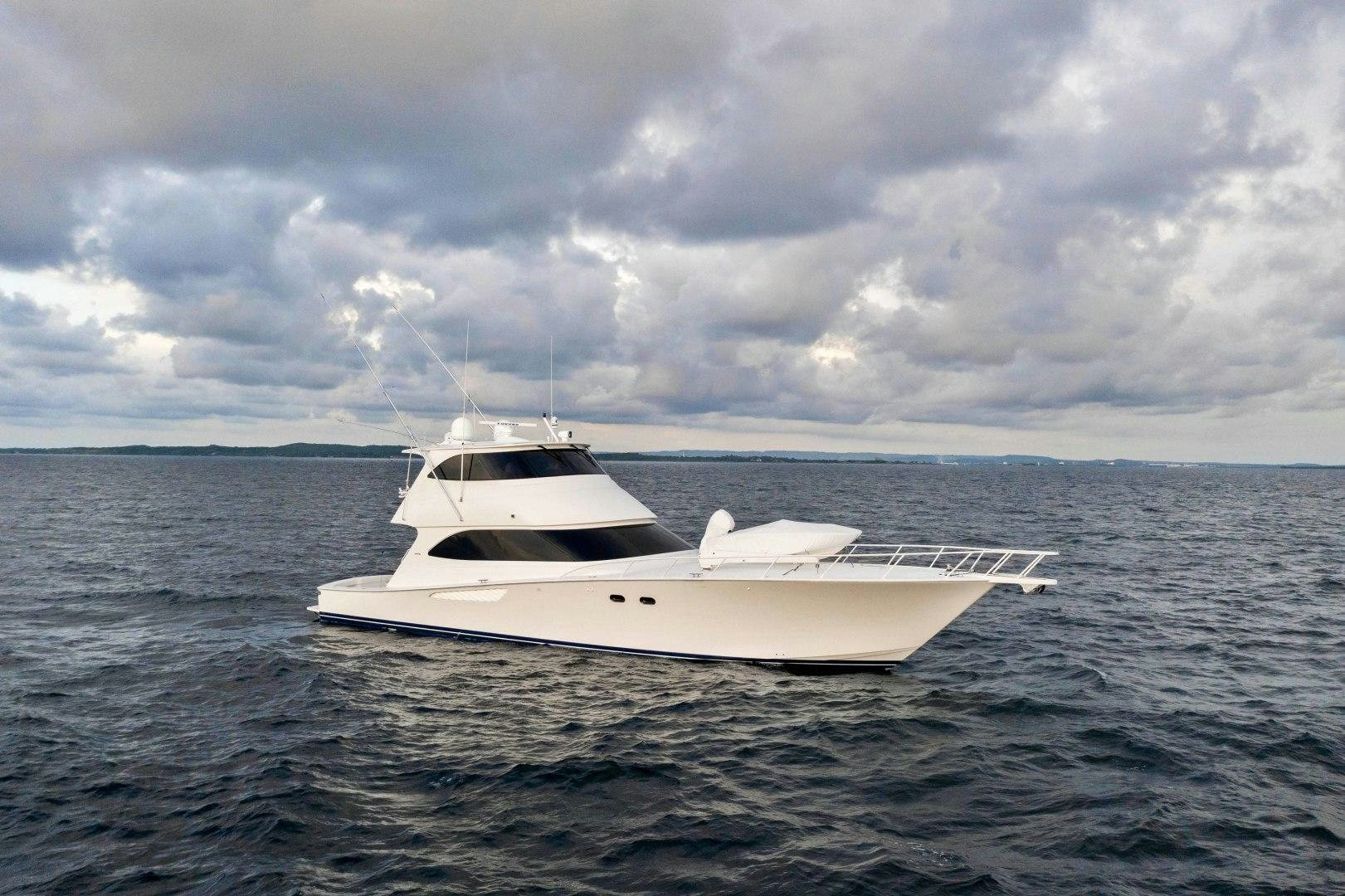 a white yacht in the water aboard LAST CALL Yacht for Sale