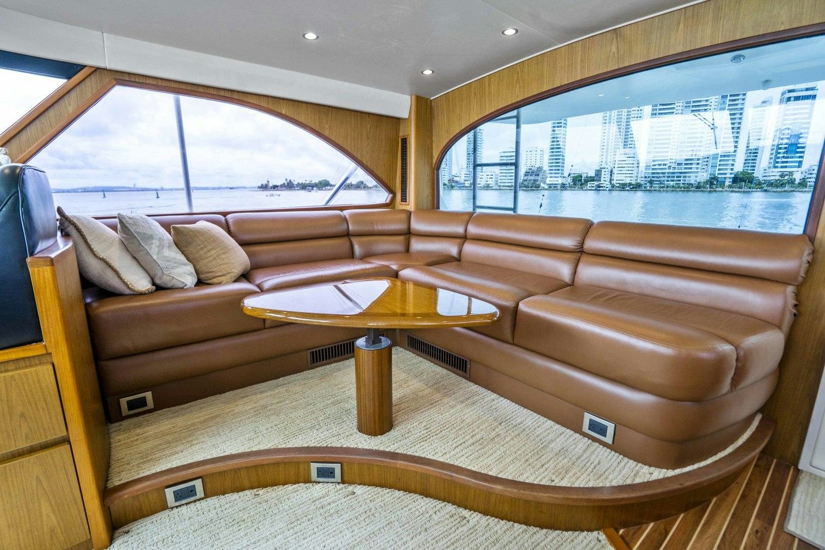 a room with a couch and a table aboard LAST CALL Yacht for Sale