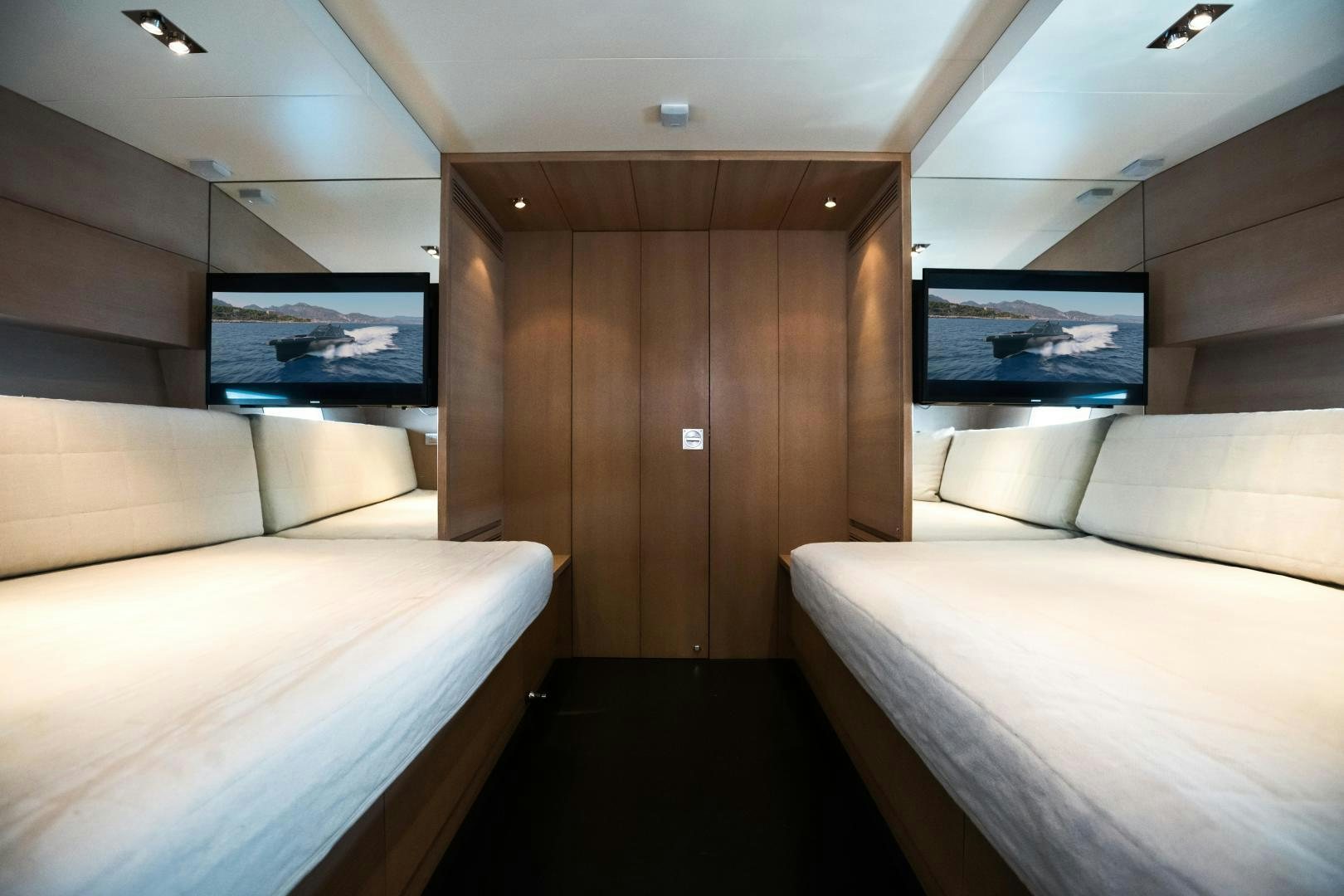 a room with couches and a television aboard ASH Yacht for Sale
