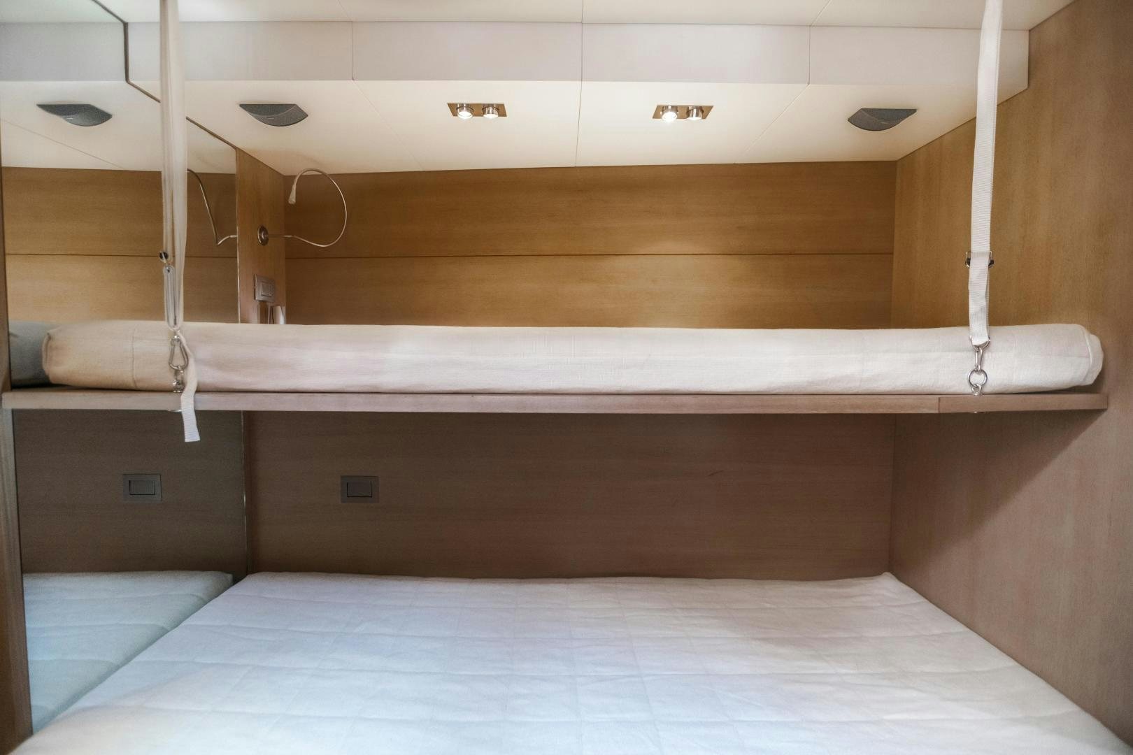 a room with a bed and a shelf aboard ASH Yacht for Sale