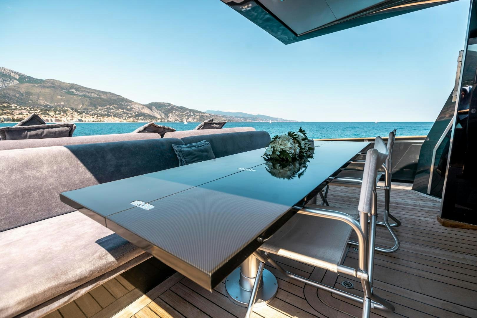 a large pool with a plant on the deck aboard ASH Yacht for Sale