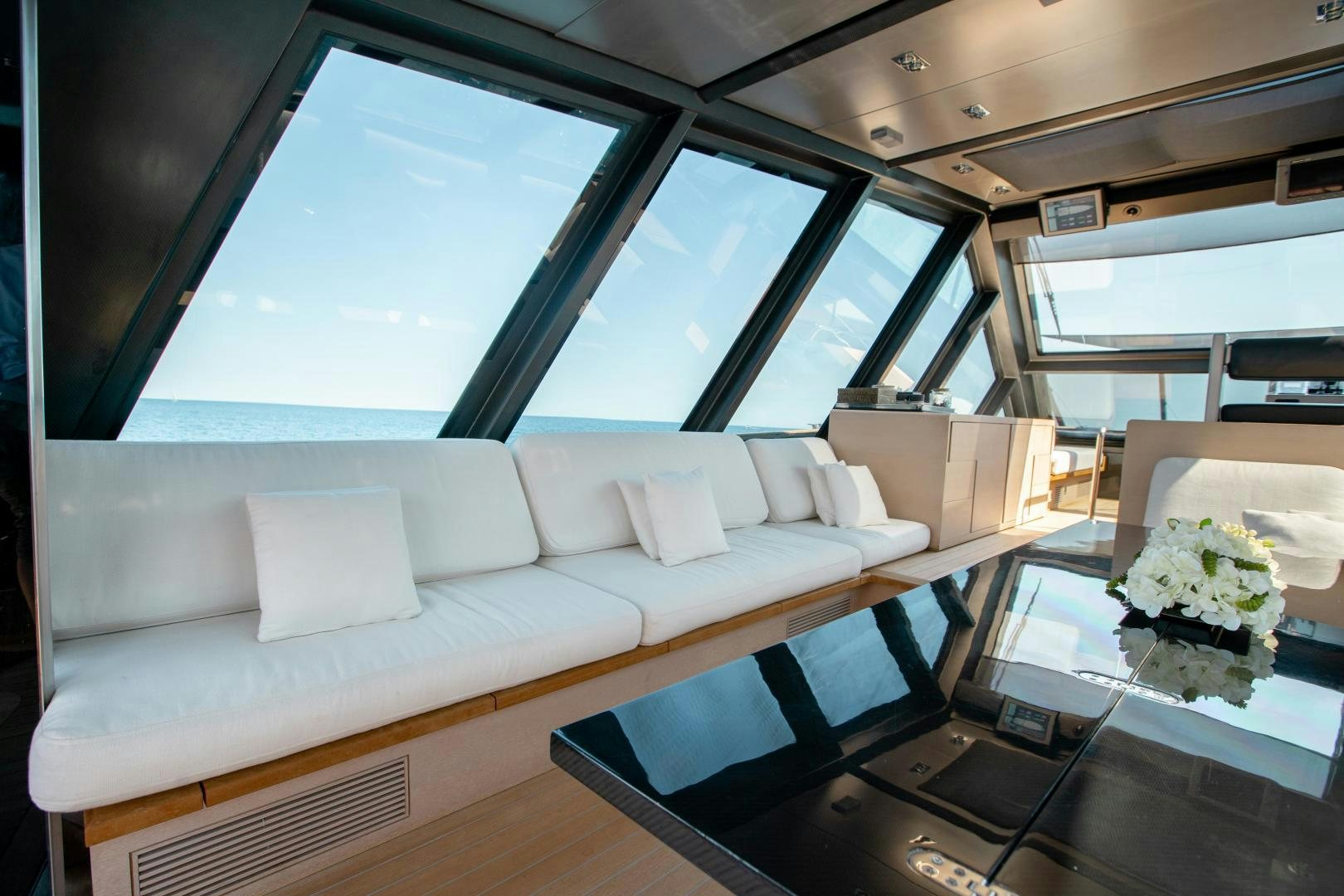a living room with a large window aboard ASH Yacht for Sale