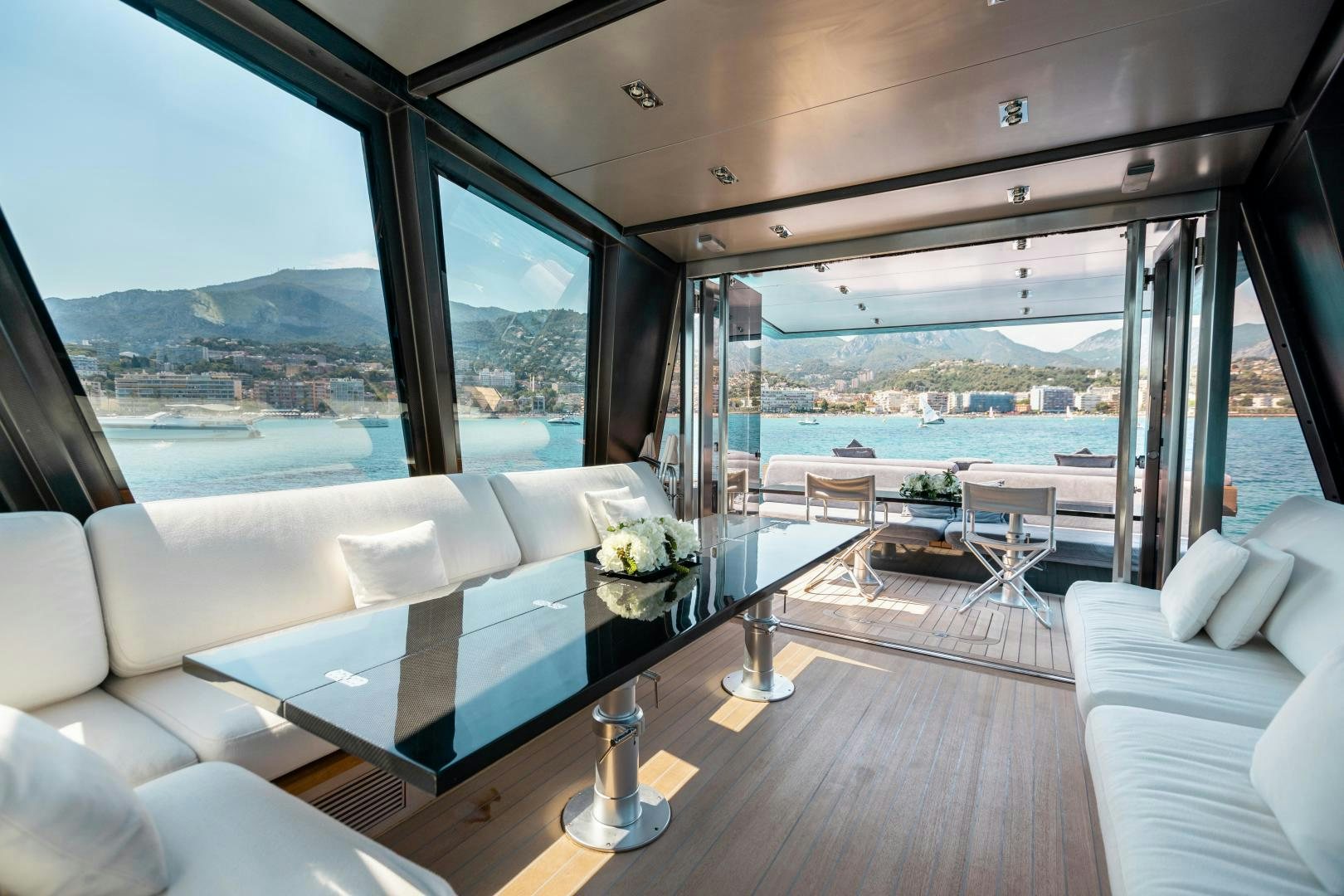 a room with a view of the ocean and the mountains aboard ASH Yacht for Sale