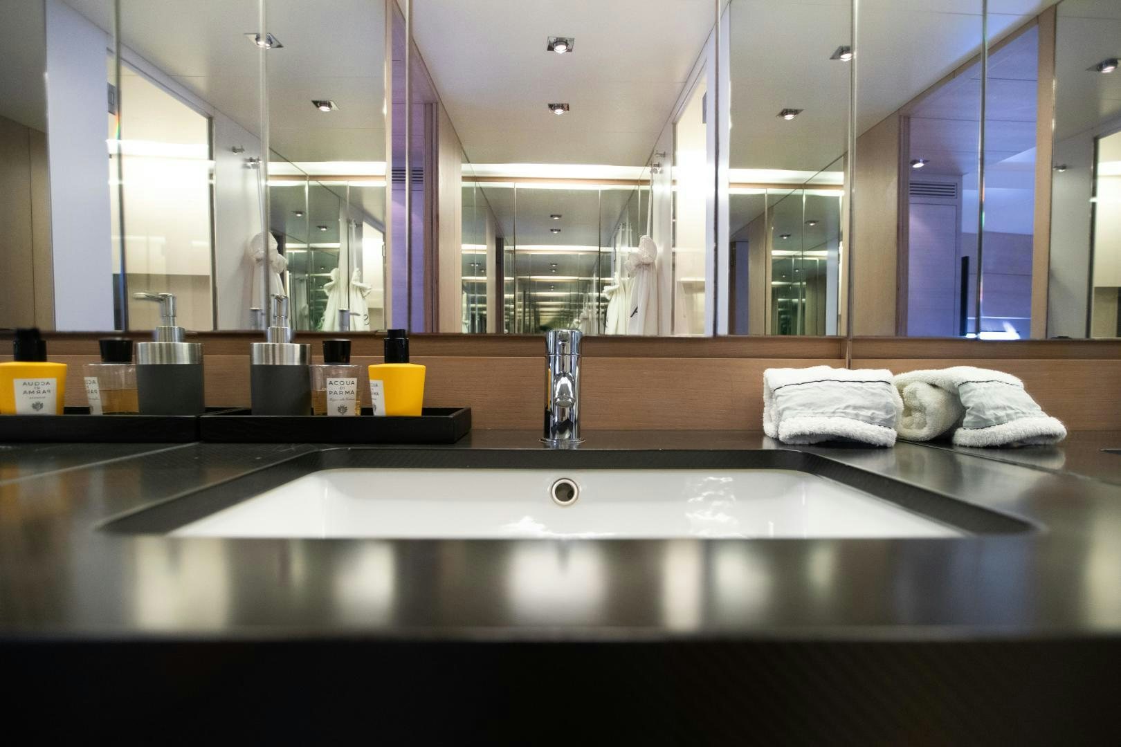 a bathroom with a large mirror aboard ASH Yacht for Sale