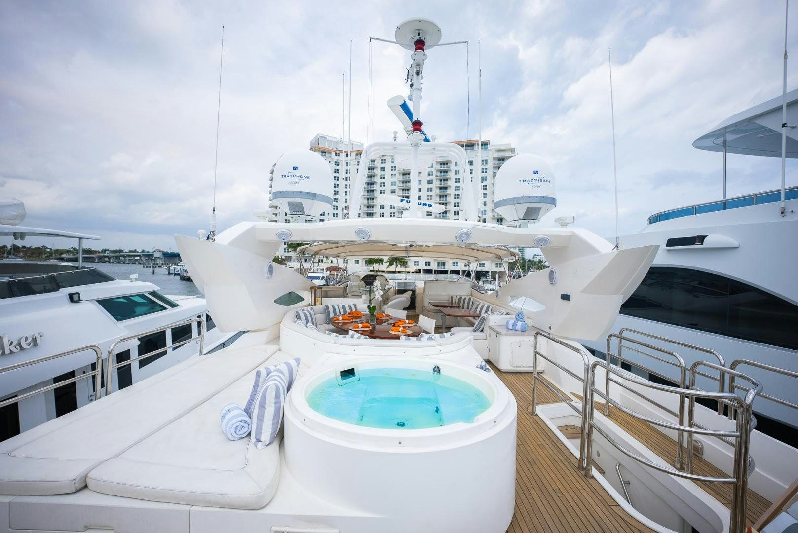 a large white boat with a blue water body aboard DELFINO Yacht for Sale