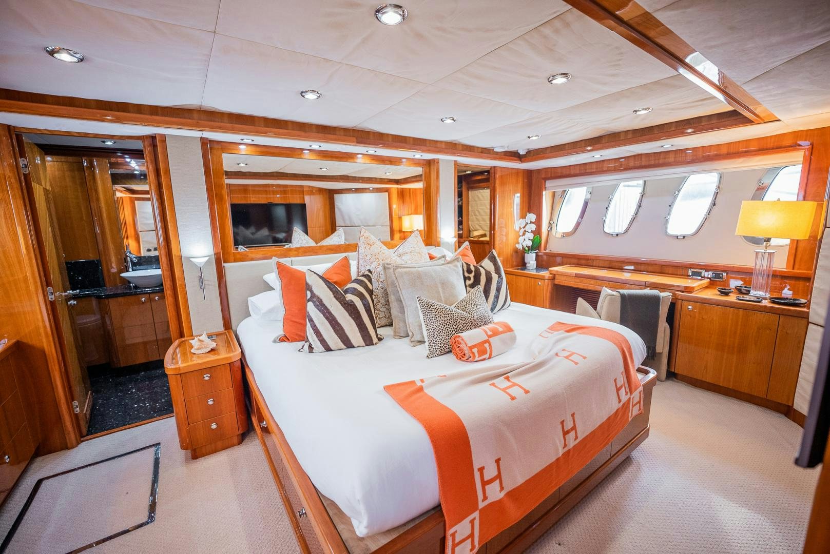 a room with a bed and a desk aboard DELFINO Yacht for Sale