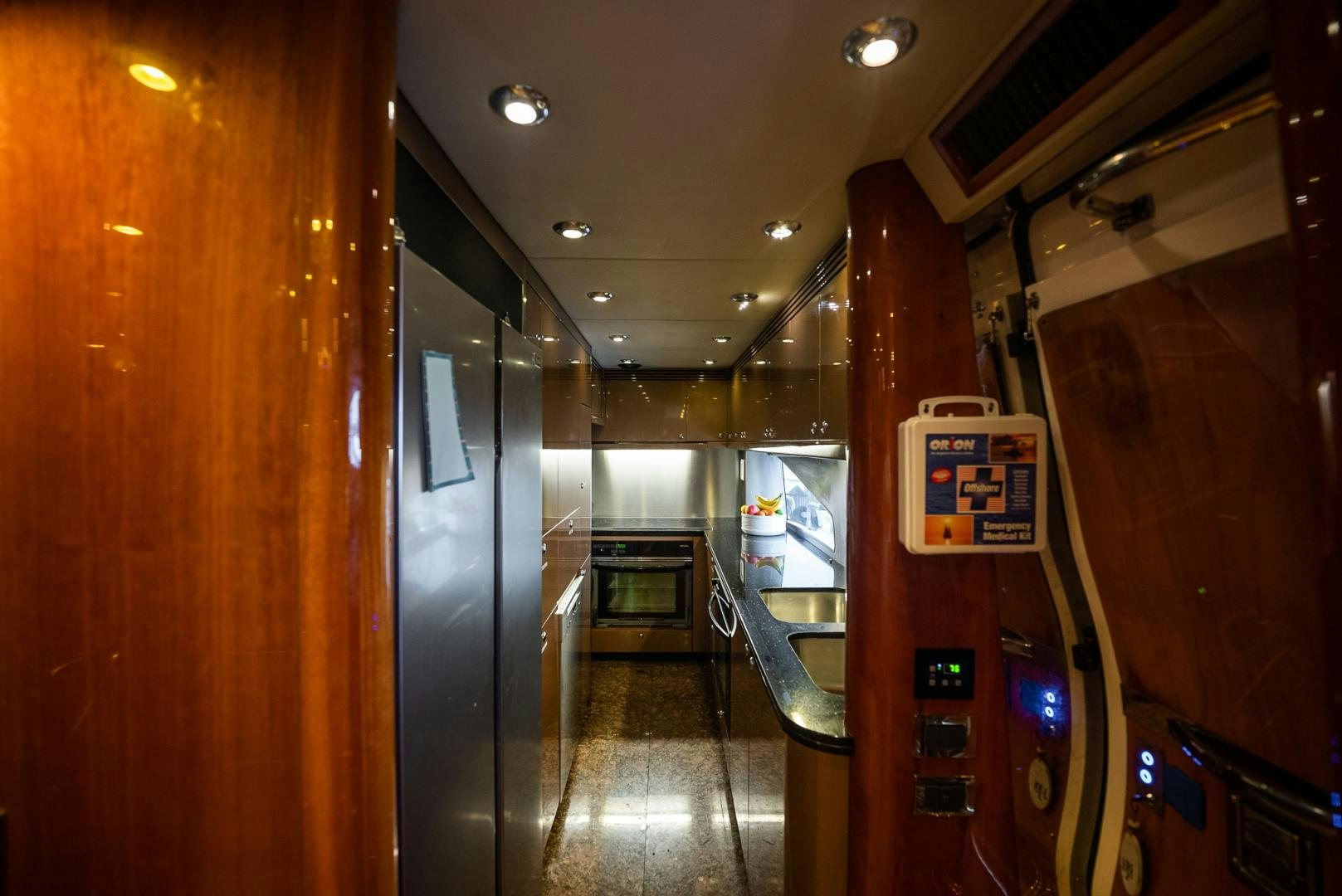 a hallway with a door and a machine on the wall aboard DELFINO Yacht for Sale