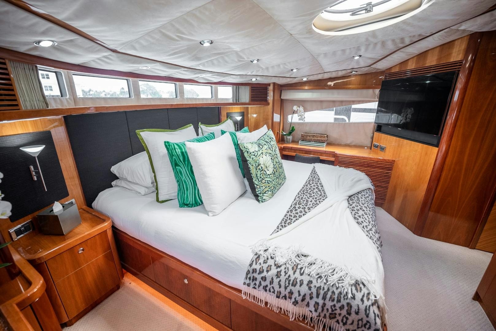 a bed with pillows and pillows aboard DELFINO Yacht for Sale
