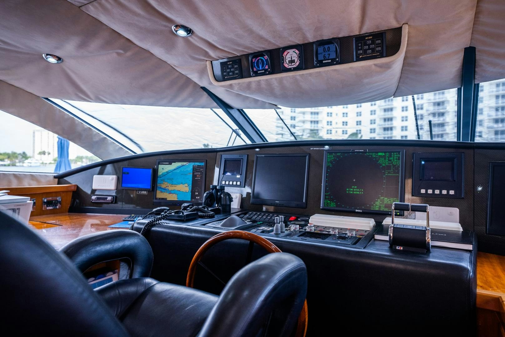a group of monitors and computers on a table aboard DELFINO Yacht for Sale