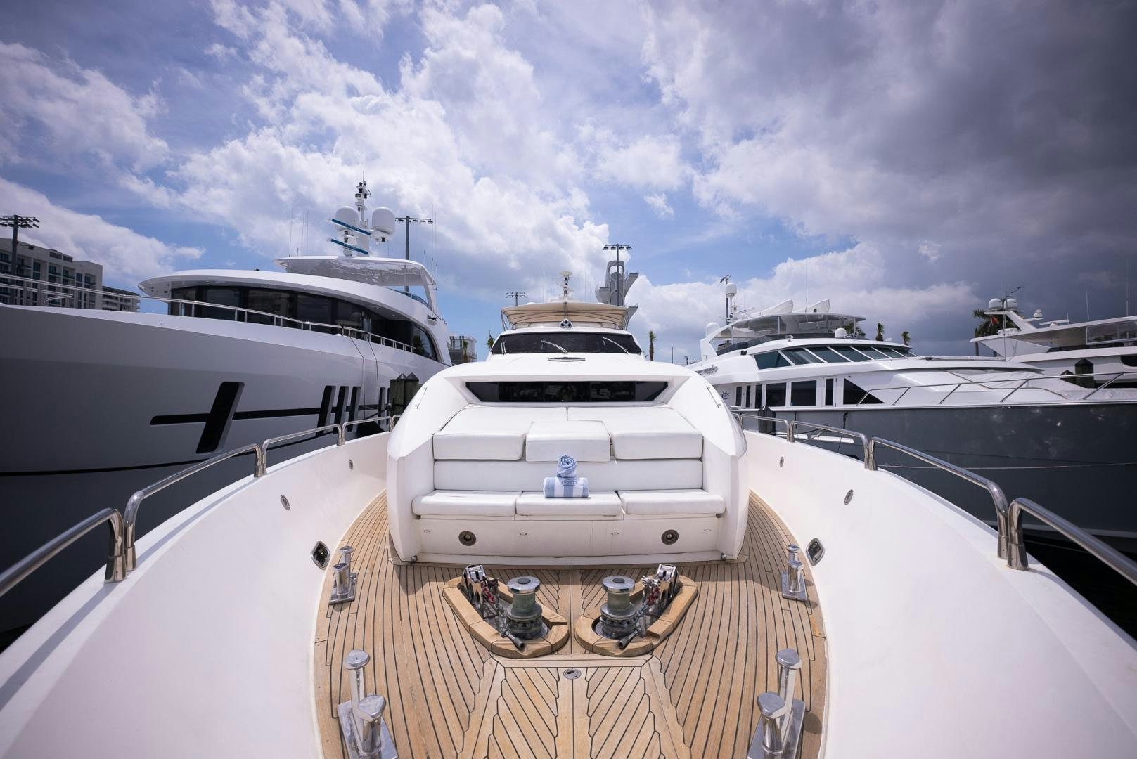 a deck with a boat and a couple of boats on it aboard DELFINO Yacht for Sale