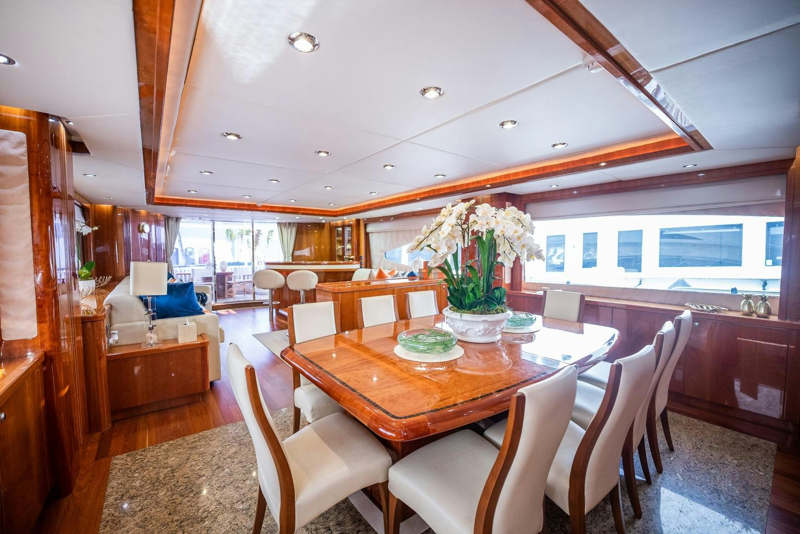 a dining room with a table and chairs aboard DELFINO Yacht for Sale