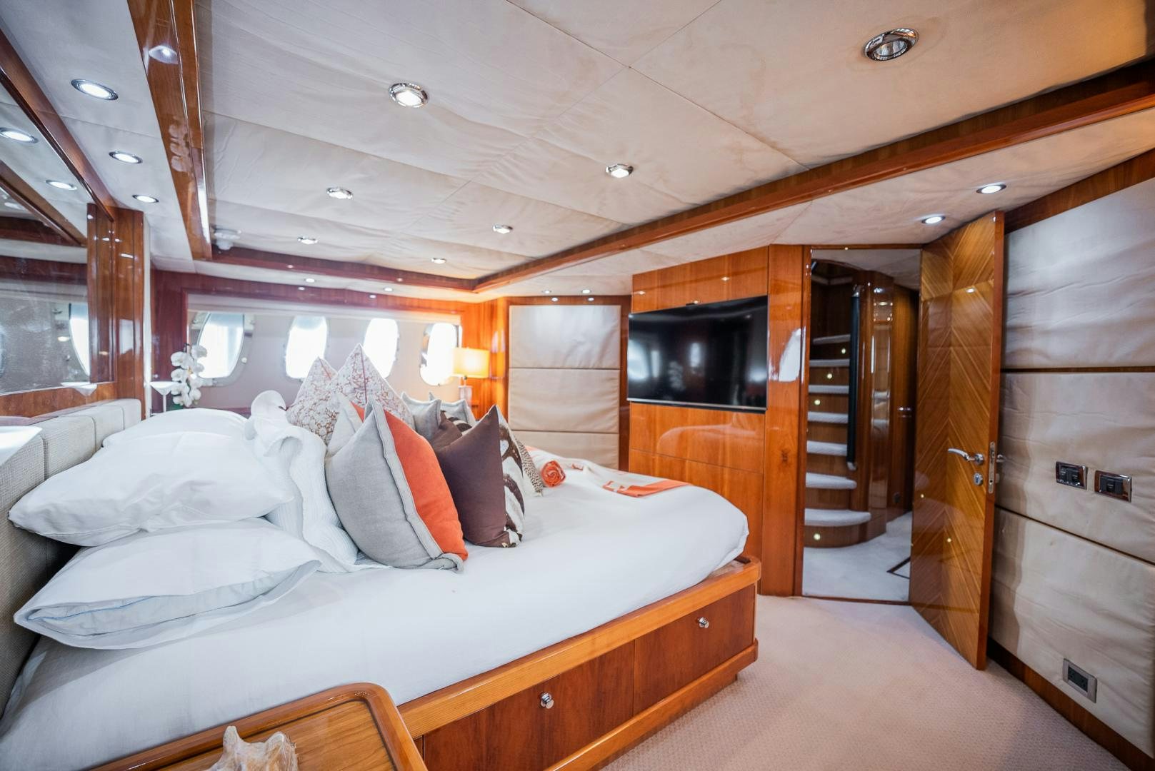 a bedroom with a bed and a television aboard DELFINO Yacht for Sale