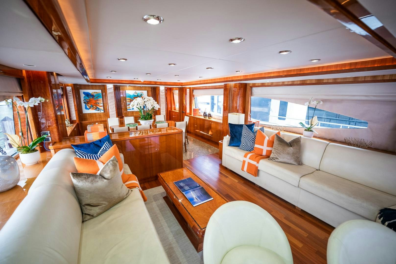 a living room with a couch and a coffee table aboard DELFINO Yacht for Sale