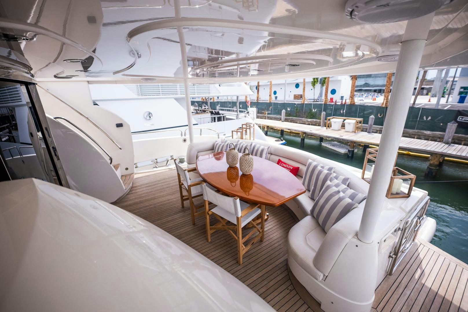 a room with tables and chairs aboard DELFINO Yacht for Sale