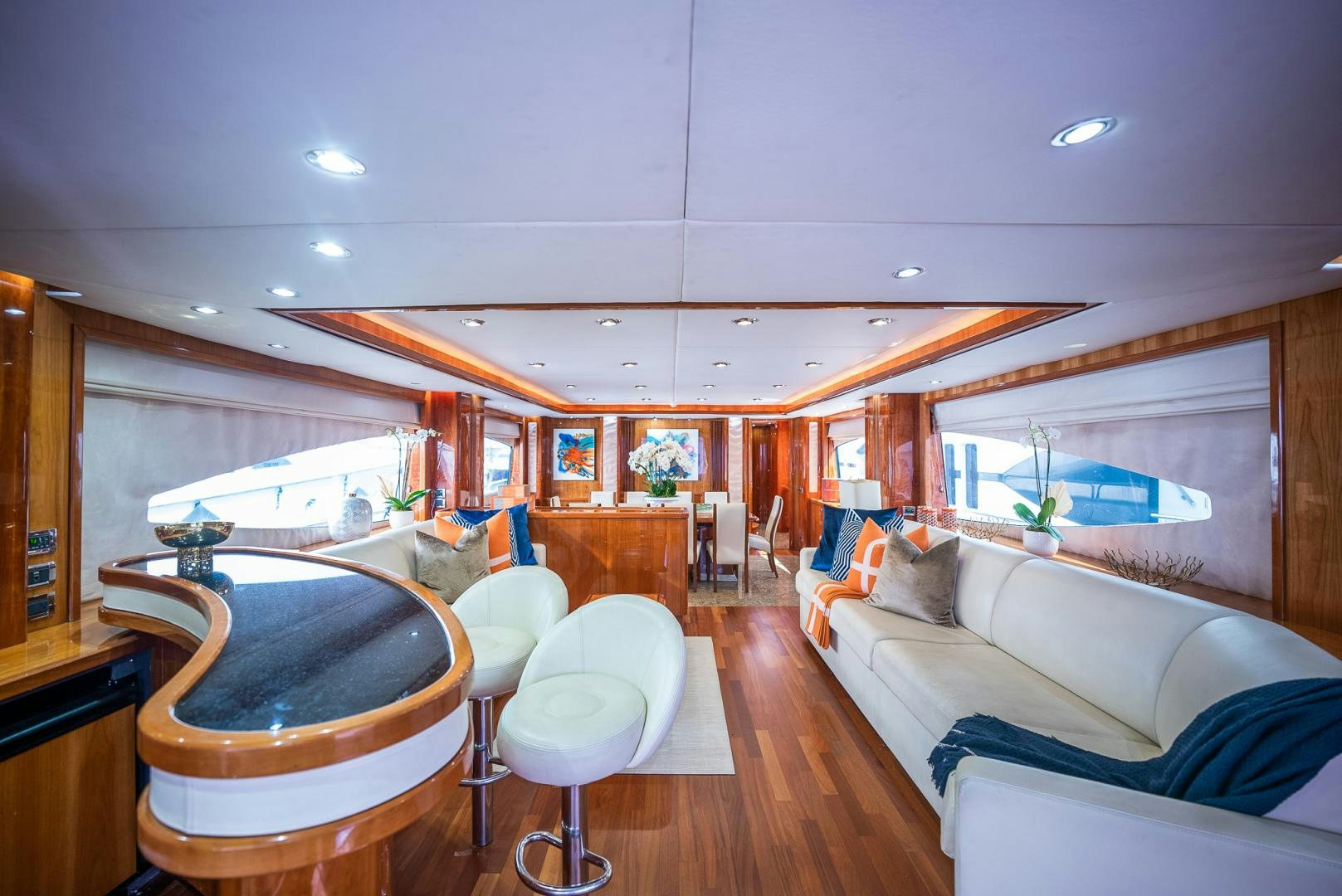 a large living room with a pool table and chairs aboard DELFINO Yacht for Sale