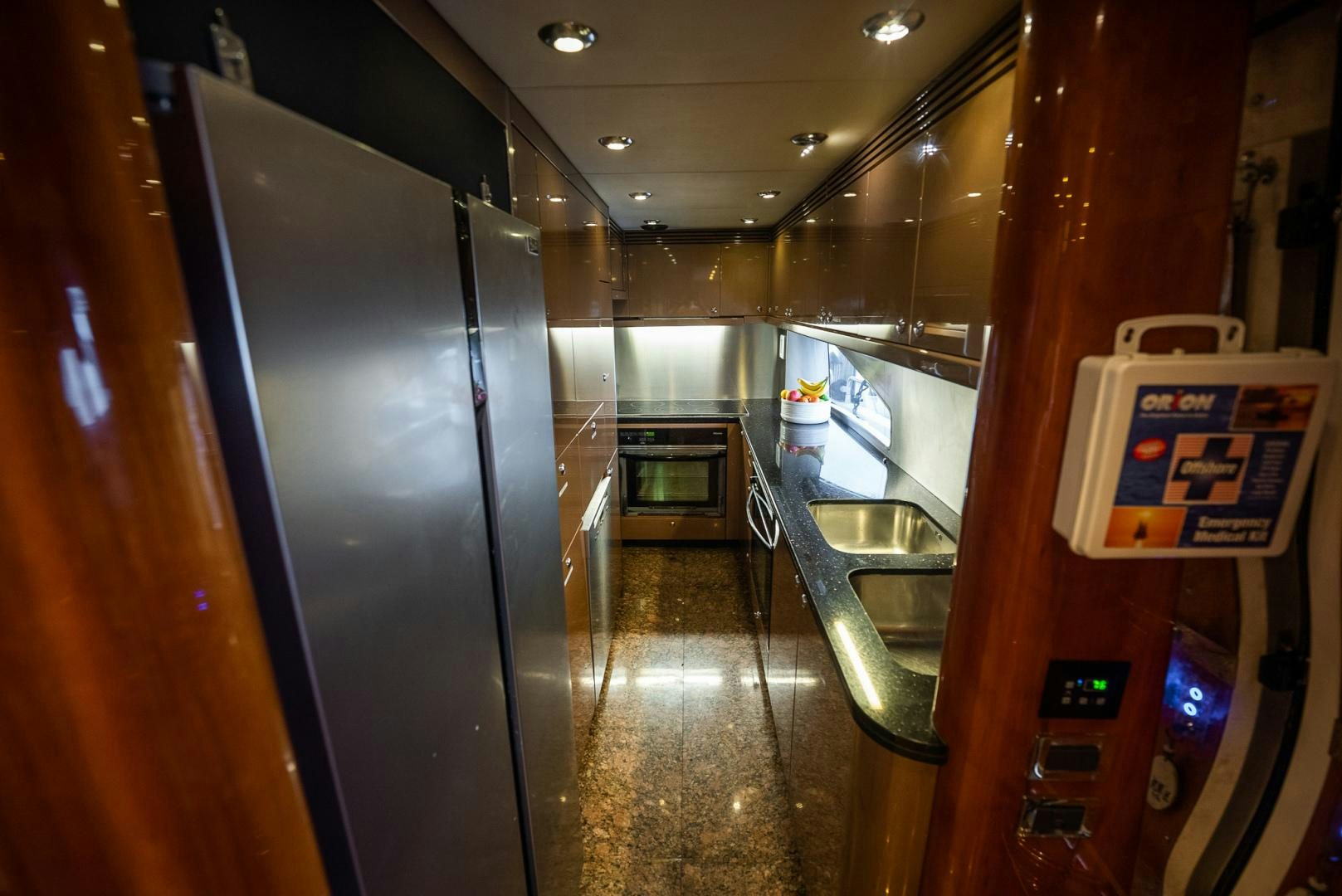 a hallway with a sink and a machine in it aboard DELFINO Yacht for Sale