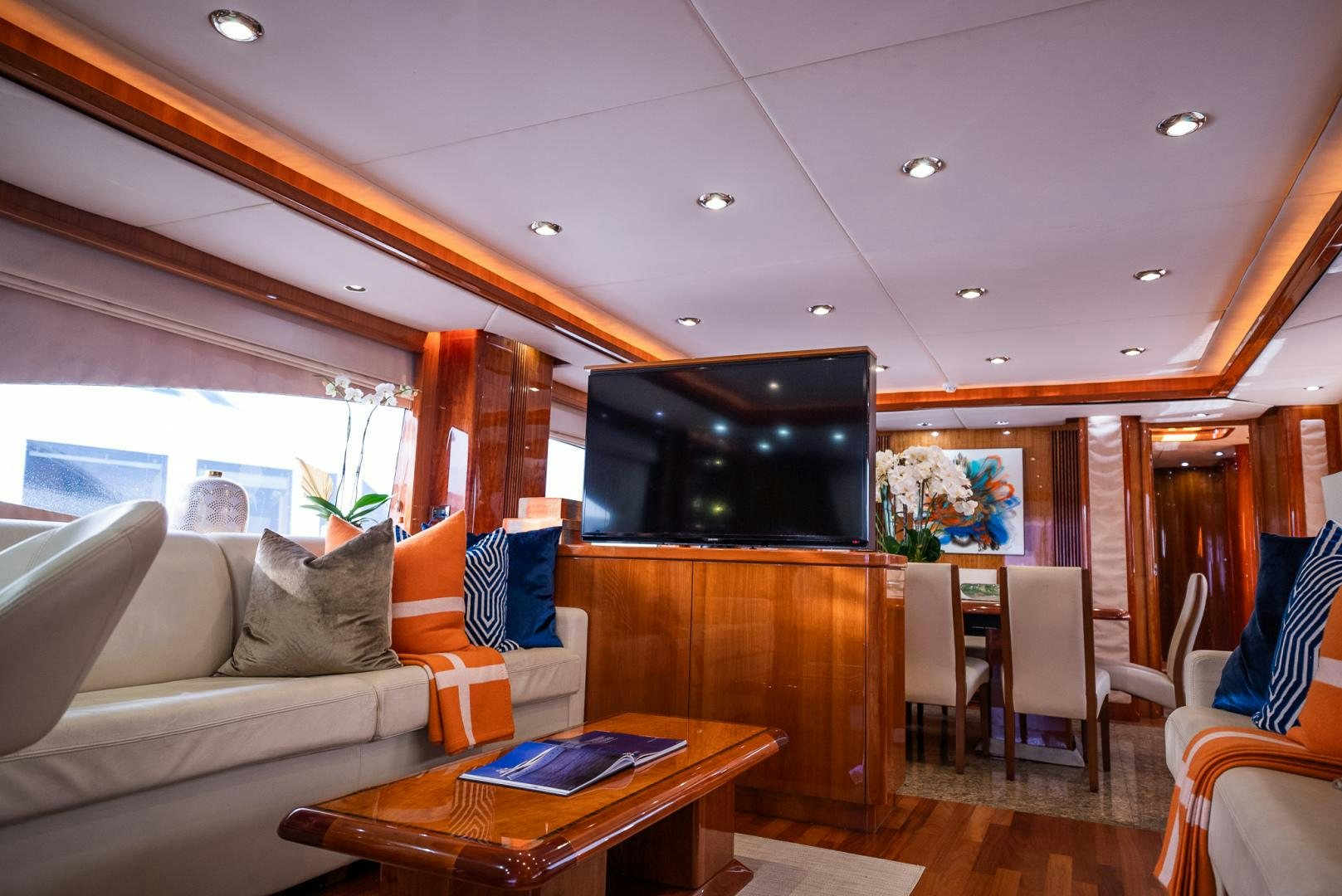 a living room with a large tv aboard DELFINO Yacht for Sale