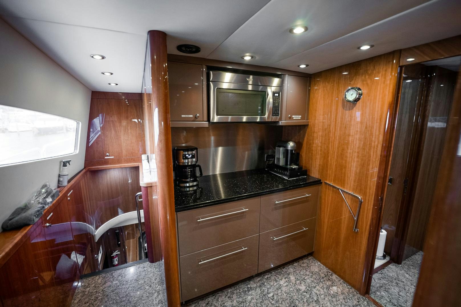 a kitchen with wooden cabinets aboard DELFINO Yacht for Sale