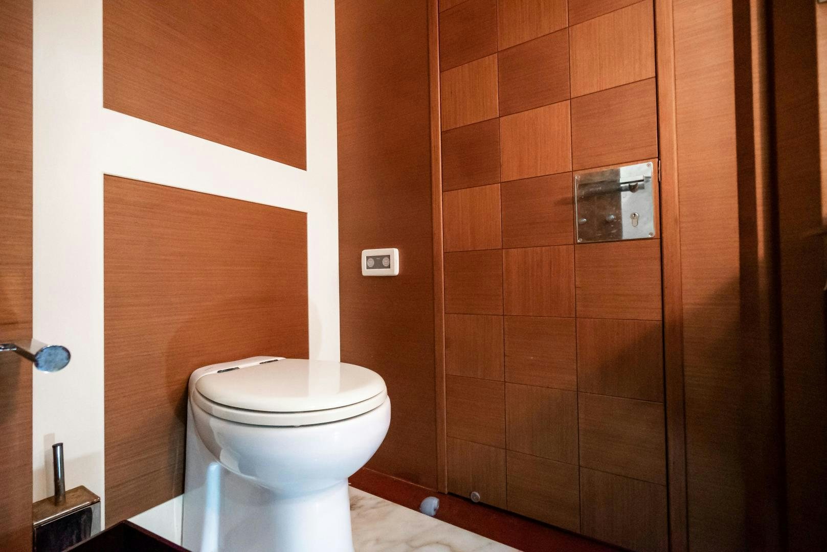 a toilet in a bathroom aboard CAMY ED Yacht for Sale