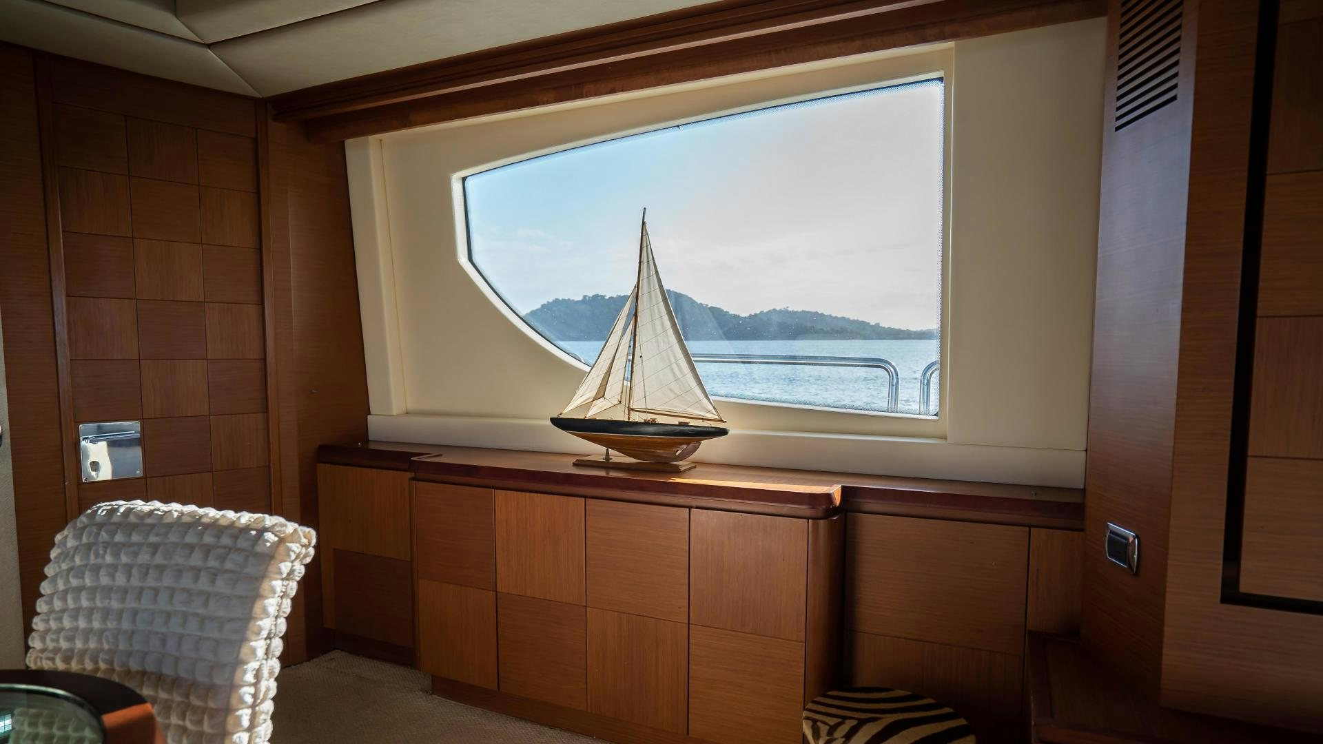 a window with a sailboat in it aboard CAMY ED Yacht for Sale