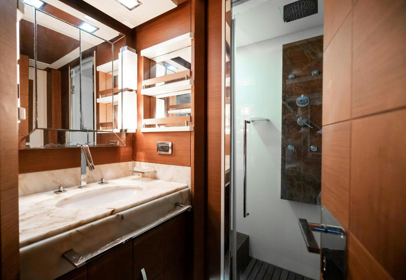 a bathroom with a large mirror aboard CAMY ED Yacht for Sale