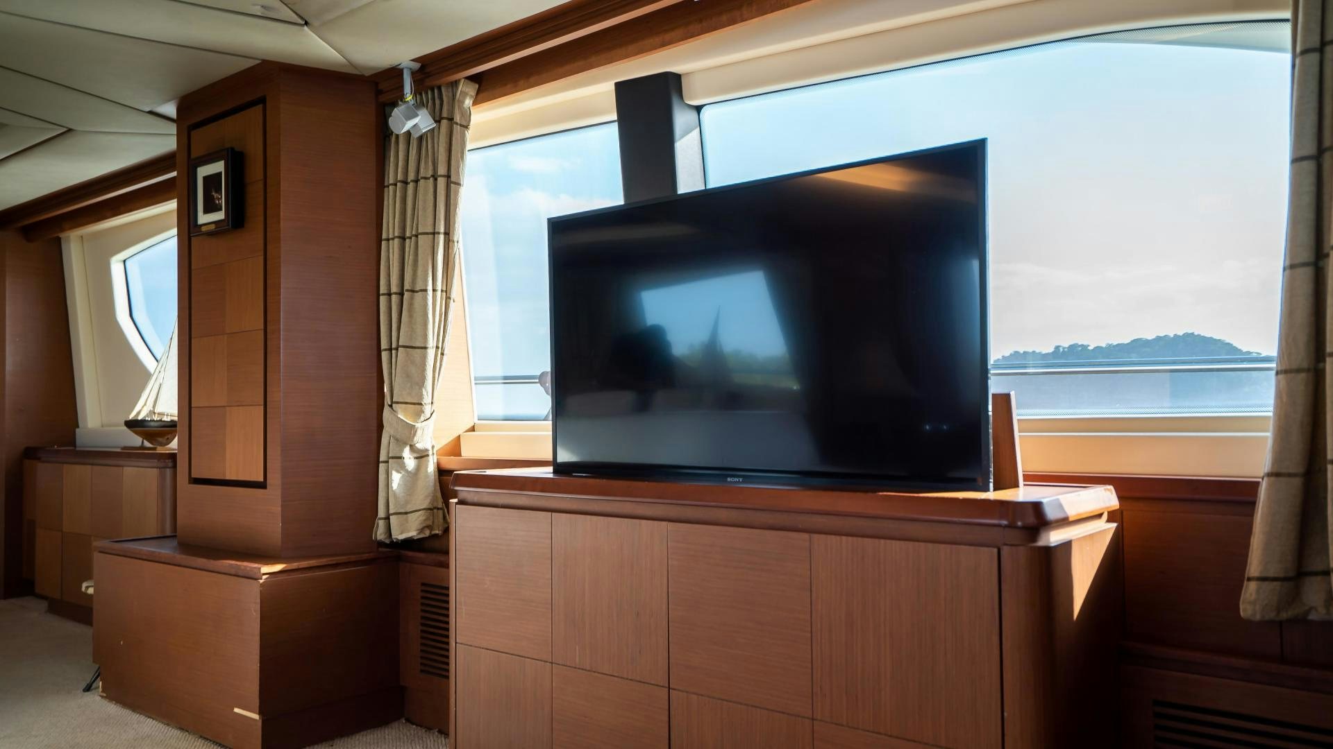 a tv on a cabinet aboard CAMY ED Yacht for Sale