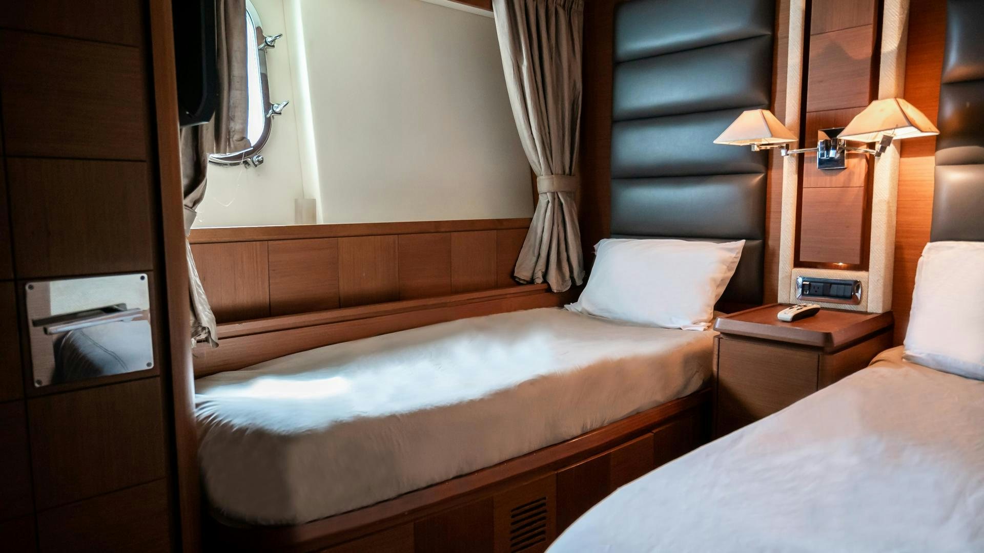 a room with two beds aboard CAMY ED Yacht for Sale