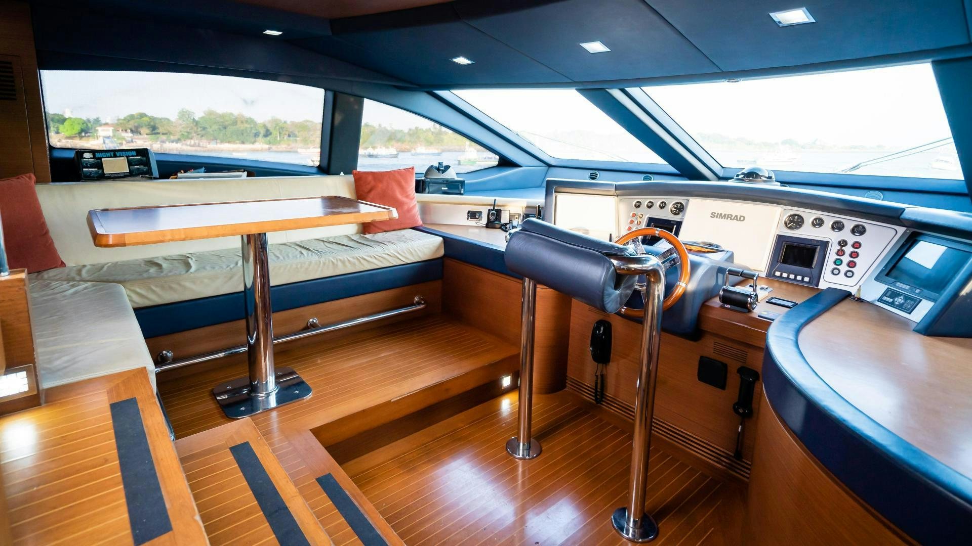 a room with a table and chairs aboard CAMY ED Yacht for Sale