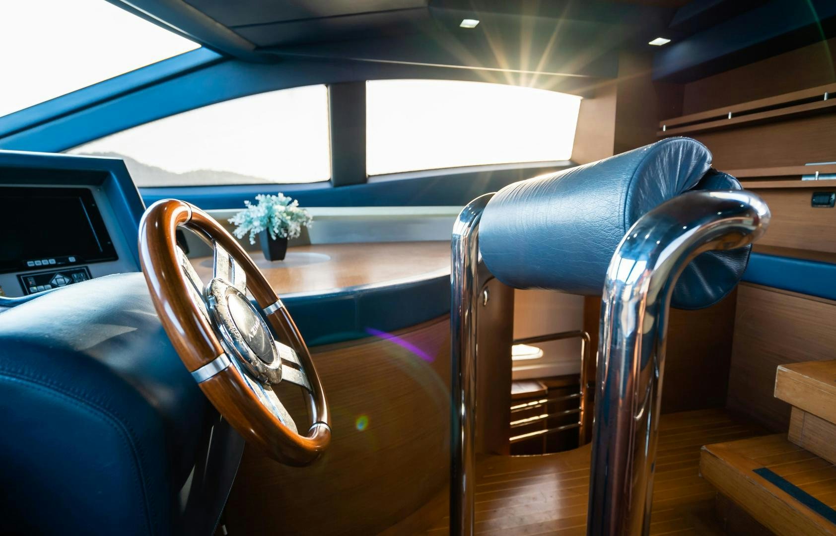 a close-up of a car's steering wheel aboard CAMY ED Yacht for Sale