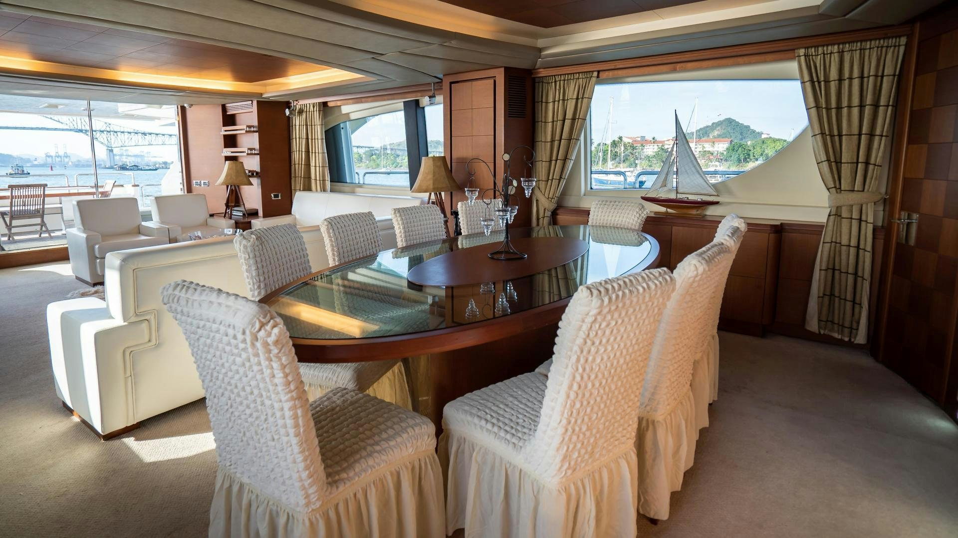 a living room with a table and chairs aboard CAMY ED Yacht for Sale