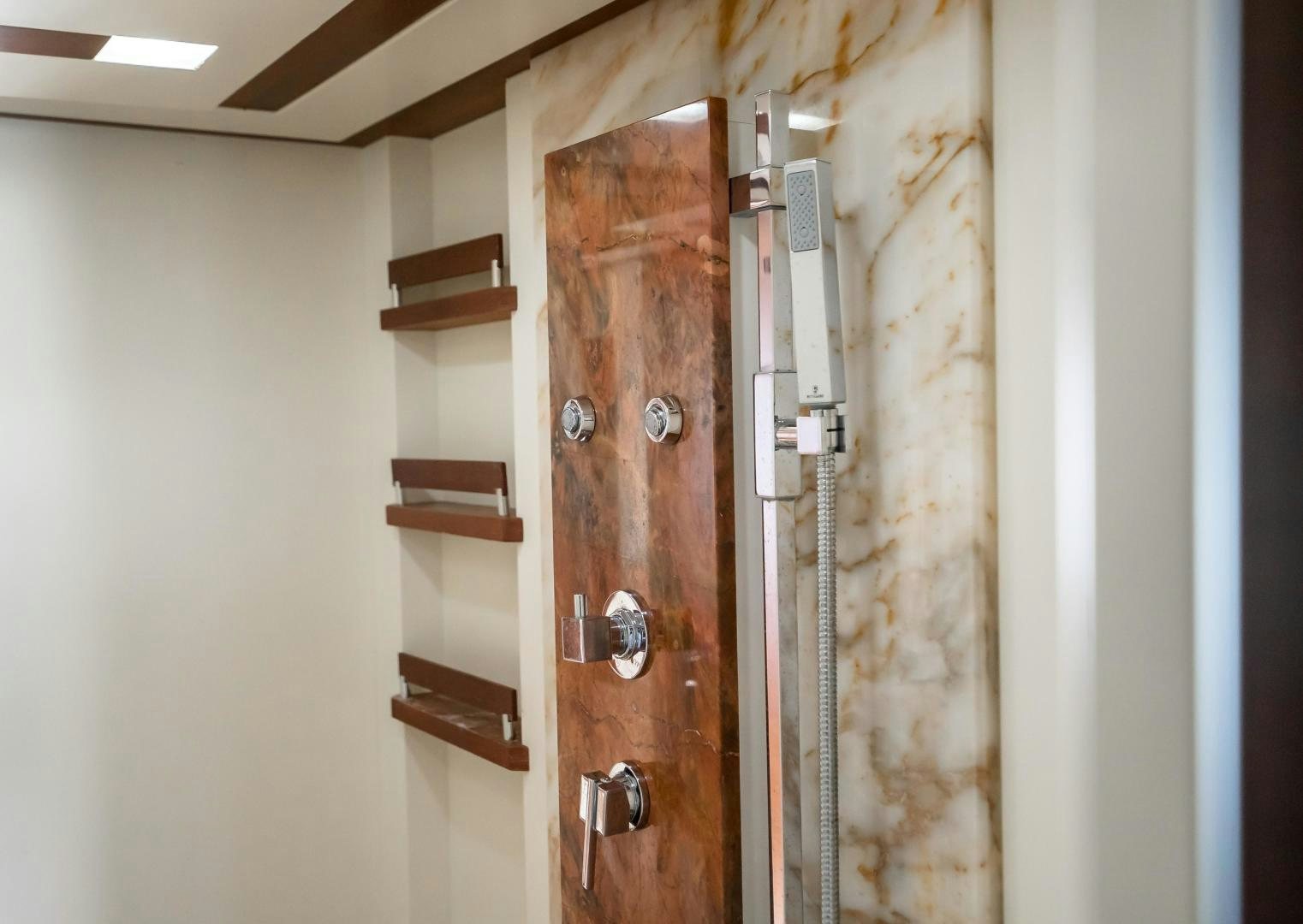 a room with a door and a shelf with a door aboard CAMY ED Yacht for Sale