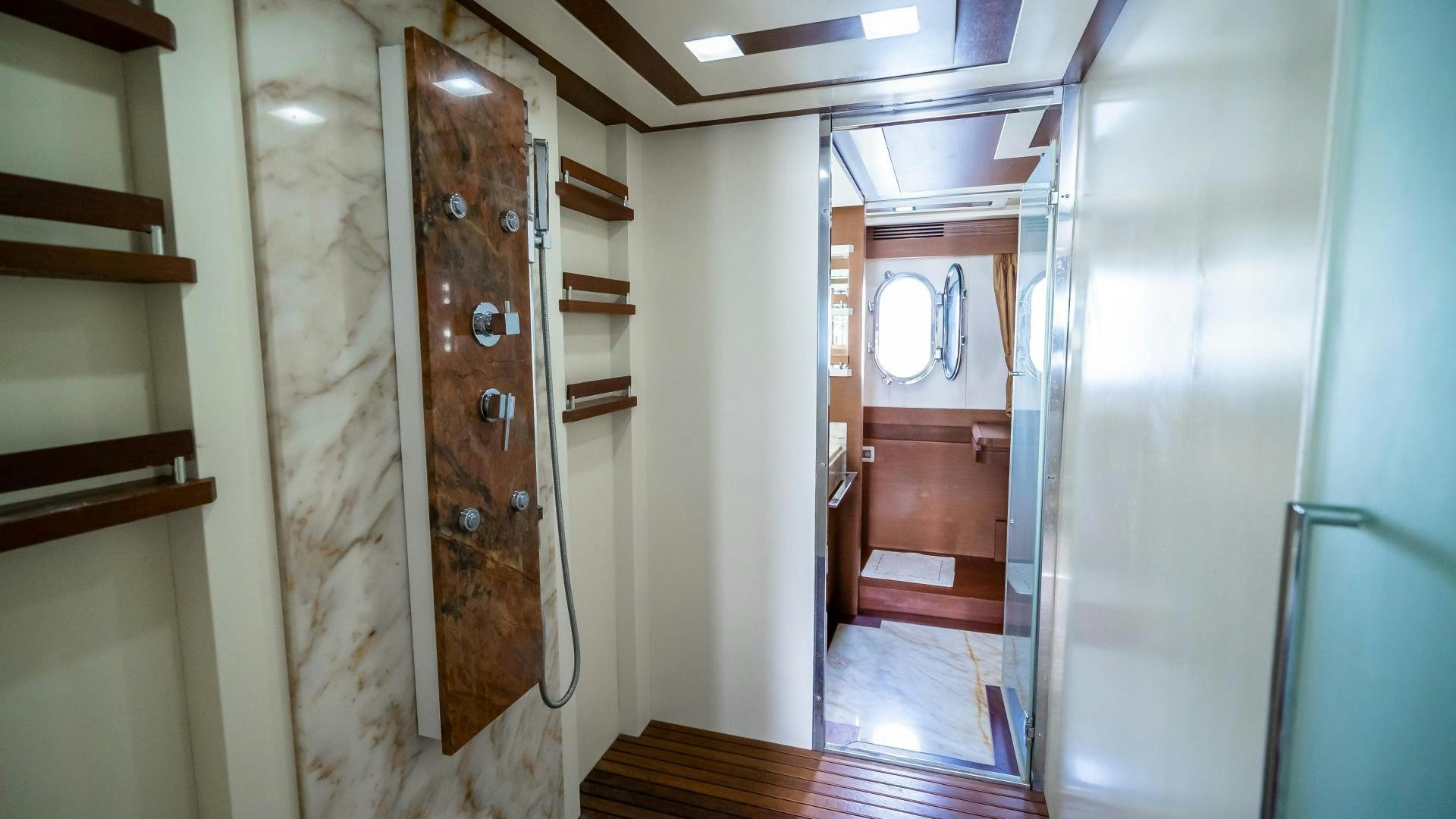a room with a wood door and a mirror aboard CAMY ED Yacht for Sale